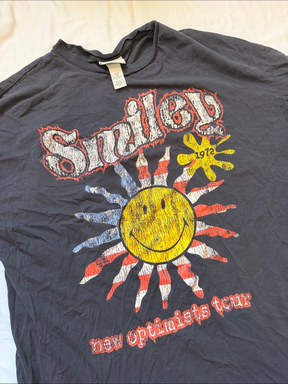 H&M Black Graphic Tee with Yellow Sun and Red/Blue Accents